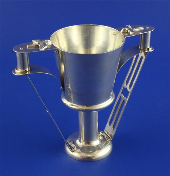 A George V Arts & Crafts silver two-handled pedestal cup. 10 oz.